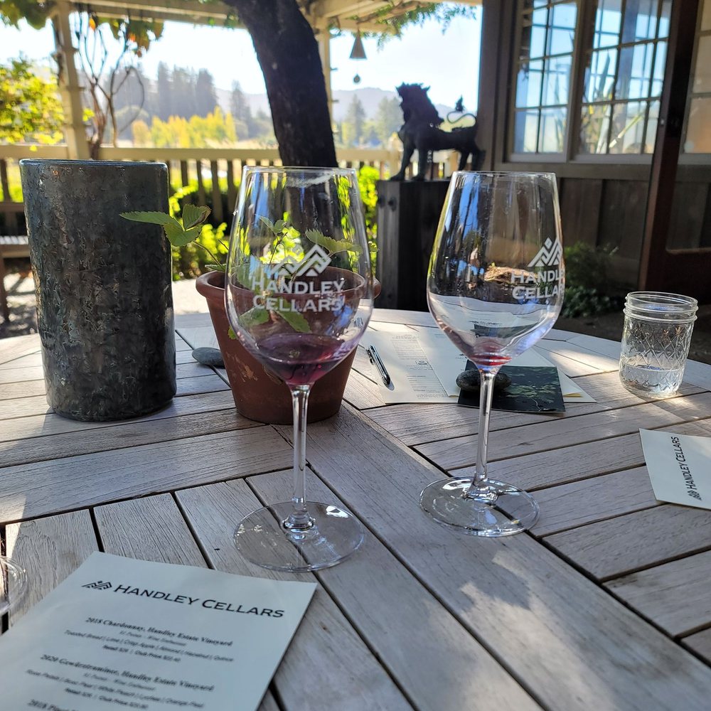 Enjoying a wine tasting on a beautiful afternoon Enjoying a wine tasting on a beautiful afternoon