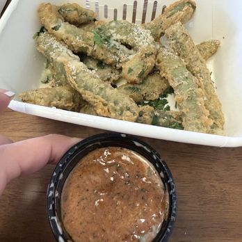 California Fish Grill - Cajun butter sauce, and fried greens. - Seafood Near Me - Cypress, California California Fish Grill - Cajun butter sauce, and fried greens. - Seafood Near Me - Cypress, California