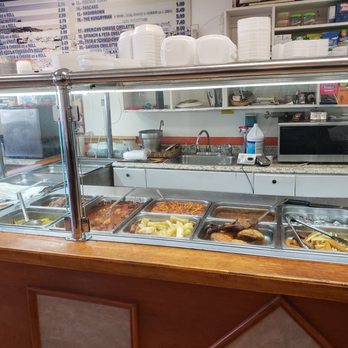 Sime Deli - a counter with a variety of food items - Greek Near Me - Farmingdale, New York Sime Deli - a counter with a variety of food items - Greek Near Me - Farmingdale, New York