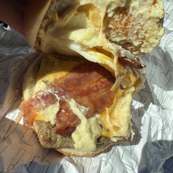 Wendy's - a hand holding a half eaten sandwich - Fast Food Near Me - Yorkville, New York Wendy's - a hand holding a half eaten sandwich - Fast Food Near Me - Yorkville, New York