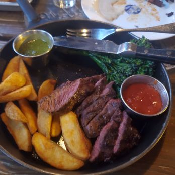 Draft Republic Carlsbad - Hangar Steak with potato wedges and broccolini. Chimichurri on side. - Comfort Food Near Me - Carlsbad, California Draft Republic Carlsbad - Hangar Steak with potato wedges and broccolini. Chimichurri on side. - Comfort Food Near Me - Carlsbad, California