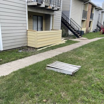 4 Sons Construction - a broken window on the sidewalk - General Contractors Near Me