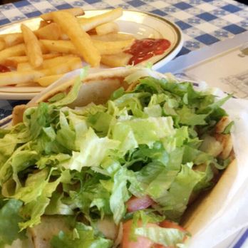 Lefteris Gyro - Hard to tell, but this is a chicken gyro and French fries obviously. - Greek Near Me - Tarrytown, New York Lefteris Gyro - Hard to tell, but this is a chicken gyro and French fries obviously. - Greek Near Me - Tarrytown, New York