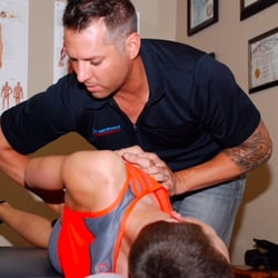 Elite Performance Chiropractic - Dr. Miller adjusting one of our clients.