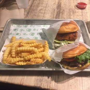 Shake Shack Century City Mall - 2nd Floor - Chicken sandwich (top right), cheeseburger (bottom right) and fries (left) - Fast Food Near Me - Los Angeles, California Shake Shack Century City Mall - 2nd Floor - Chicken sandwich (top right), cheeseburger (bottom right) and fries (left) - Fast Food Near Me - Los Angeles, California