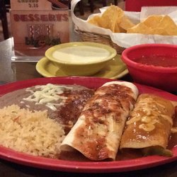El Bigotes Mexican Grill - Beef burrito, Chicken enchilada with rice and refried beans, cheese sauce, salsa and chips!