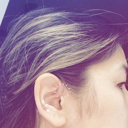 Front helix and regular helix piercings.