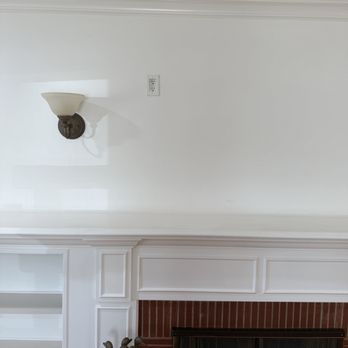 Shining Light Electric - TV outlet above fireplace - Electricians Near Me