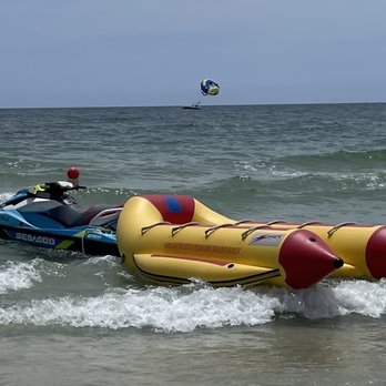 Ike's Beach Service - Banana boat and jet ski. Parasail boat in background. - Boating Near Me - Gulf Shores, Alabama Ike's Beach Service - Banana boat and jet ski. Parasail boat in background. - Boating Near Me - Gulf Shores, Alabama