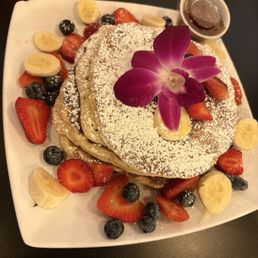 Stack of buttermilk pancakes with fruit