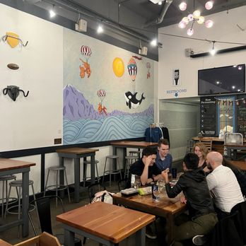 Flying Bike Cooperative Brewery - a group of people sitting at tables - Breweries Near Me - Seattle, Washington Flying Bike Cooperative Brewery - a group of people sitting at tables - Breweries Near Me - Seattle, Washington