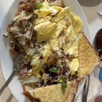 Rosie's Cafe - This is a Supreme Breakfast Skillet after was attacked with a fork. - Diners Near Me - La Crosse, Wisconsin Rosie's Cafe - This is a Supreme Breakfast Skillet after was attacked with a fork. - Diners Near Me - La Crosse, Wisconsin