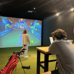 Fairways Golf Simulators - Couple playing games