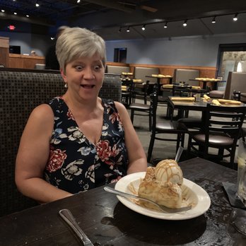 Local Goat - White chocolate bread pudding with salted caramel sauce. - New American Near Me - Pigeon Forge, Tennessee