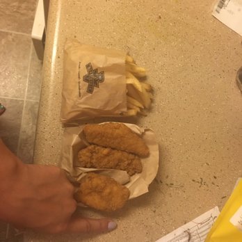Burgerville - a person holding a bag of fried chicken - Fast Food Near Me - Vancouver, Washington Burgerville - a person holding a bag of fried chicken - Fast Food Near Me - Vancouver, Washington