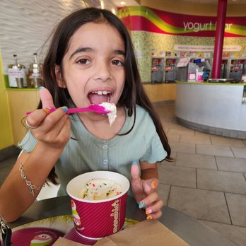 Menchie's Frozen Yogurt - My daughter is enjoying her vanilla with sprinkles - Ice Cream & Frozen Yogurt Near Me - Katy, Texas Menchie's Frozen Yogurt - My daughter is enjoying her vanilla with sprinkles - Ice Cream & Frozen Yogurt Near Me - Katy, Texas