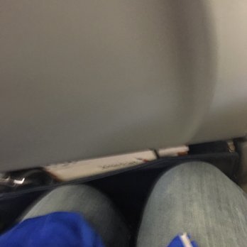 American Airlines - This is when I sat down. I never could bring my purse up from under the seat in front of me. - Airlines Near Me - Chicago, Illinois