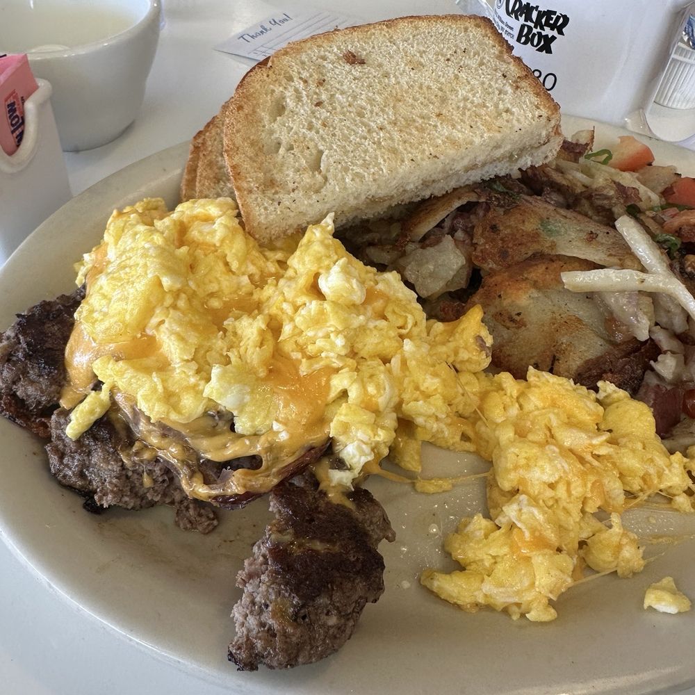 Cracker Box Restaurant - Scrambled eggs with melted cheese, grilled onions, potato hash, ground chuck steak and buttered sourdough toast. - American Near Me - Carson City, Nevada Cracker Box Restaurant - Scrambled eggs with melted cheese, grilled onions, potato hash, ground chuck steak and buttered sourdough toast. - American Near Me - Carson City, Nevada