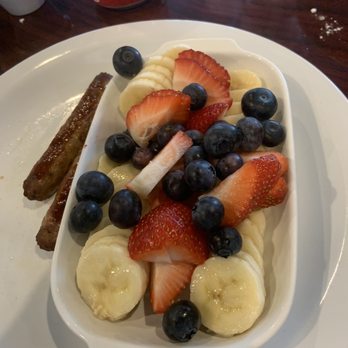 Shelly's Cafe - The fruit that comes along side the pancakes and the sausage links. - Breakfast & Brunch Near Me - Tampa, Florida