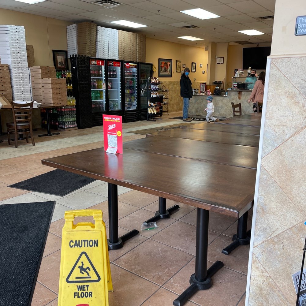 Palumbo's II - a caution sign on the floor - Pizza Near Me - Stroudsburg, Pennsylvania