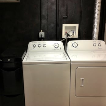 2201 Powell, LLC - Separate laundry room has large capacity washer and dryer, iron and board - Guest Houses Near Me - Columbia, Missouri