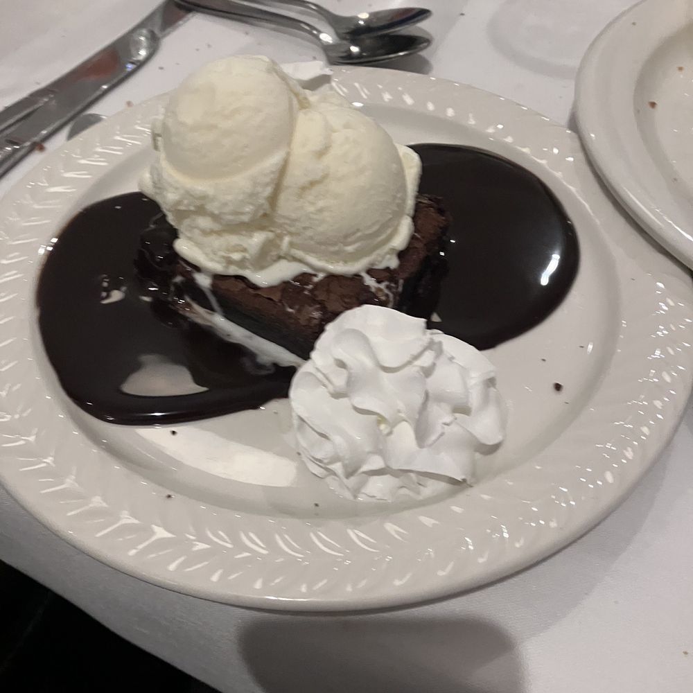 Howard's Seafood Restaurant - Brownie with ice cream, whoop cream, and chocolate glaze. - Seafood Near Me - Beach Haven Gardens, New Jersey Howard's Seafood Restaurant - Brownie with ice cream, whoop cream, and chocolate glaze. - Seafood Near Me - Beach Haven Gardens, New Jersey