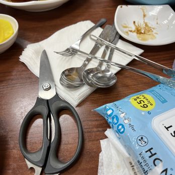 Manna Noodle House - a pair of scissors on a table - Korean Near Me - Houston, Texas Manna Noodle House - a pair of scissors on a table - Korean Near Me - Houston, Texas