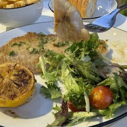 More of the skate fish with fries and bread in the background