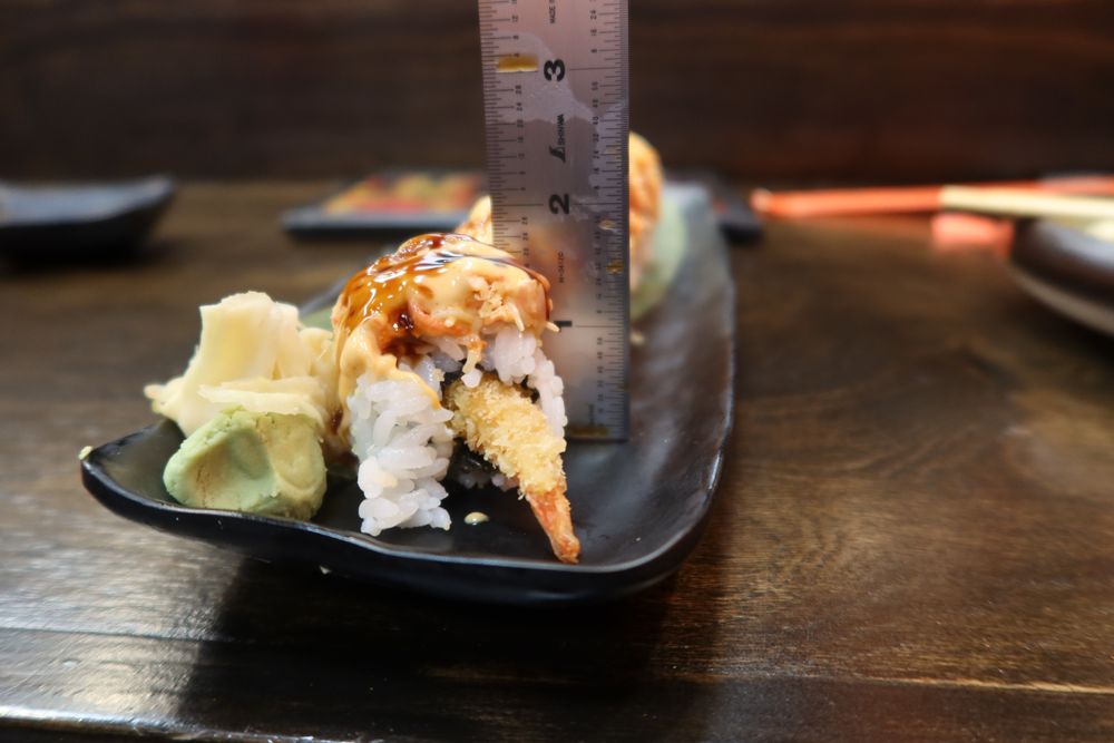 Reeko’s Sushi & Thai Cuisine Logo