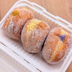 Malasadas: Ube Cream, Lilikoi Cream, Mango