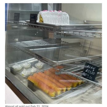 Dulce Primor - an assortment of pastries in a display case - Bakeries Near Me - Jacksonville, Florida
