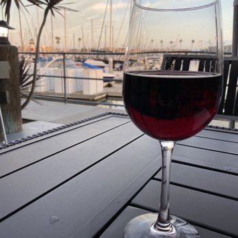 Oceanside Broiler - Glass of Cabernet Sauvignon over view of the marina - Seafood Near Me - Oceanside, California