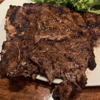 Outback Steakhouse - What I got. Melbourne Porterhouse is supposed to be the strip and filet.  My filet looks like it was filleted by a dingo. - Steakhouses Near Me - Bakersfield, California