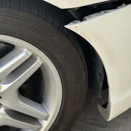 Custom imported sports bumper kit separating from fender quarter panel. Custom imported sports bumper kit separating from fender quarter panel.