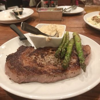 Rev Cafe - 14 oz pan seared ribeye, Gouda grits (served with utensils in the food) - Bars Near Me - Monticello, Florida Rev Cafe - 14 oz pan seared ribeye, Gouda grits (served with utensils in the food) - Bars Near Me - Monticello, Florida