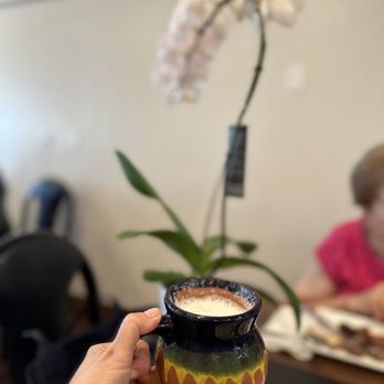 Patogh Restaurant - a person holding a cup of coffee - Middle Eastern Near Me - Turlock, California Patogh Restaurant - a person holding a cup of coffee - Middle Eastern Near Me - Turlock, California