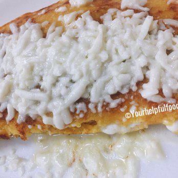Chamos Cafe - an enchilada on a white plate - Venezuelan Near Me - Doral, Florida