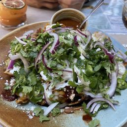 Mole Chilaquiles, I always ask for extra onion