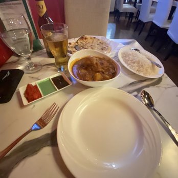 Taj India - Taj Mahal beer, Chicken Vindaloo with Basmati Rice, and Garlic Naan. - Indian Near Me - Manchester, New Hampshire Taj India - Taj Mahal beer, Chicken Vindaloo with Basmati Rice, and Garlic Naan. - Indian Near Me - Manchester, New Hampshire