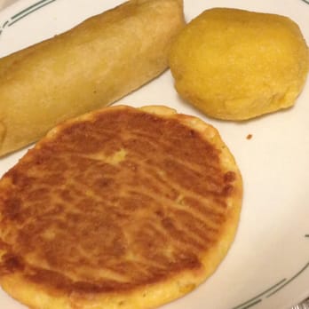 Colombia Bakery - The front flat pastry has a sweet corn exterior with chunks of corn throughout. - Bakeries Near Me - Hackensack, New Jersey