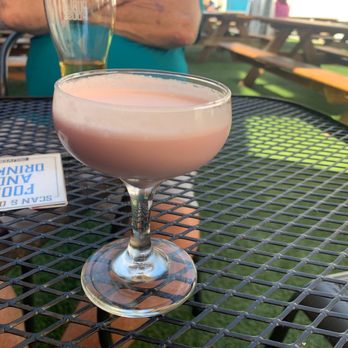 Whiskey Lab - a pink drink in a glass on a table - Whiskey Bars Near Me - Springfield, Oregon