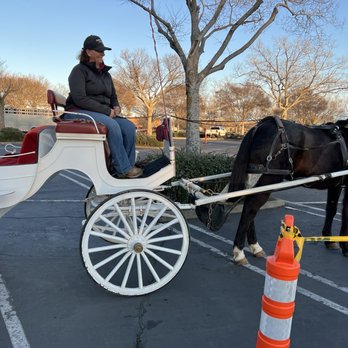 Chick-fil-A - ows a woman sitting in a horse drawn carriage - Fast Food Near Me - Vacaville, California