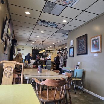 The Grafted Root Eatery - I love the old school tables and chairs. My granny had this exact yellow one where the sides fold down. - New American Near Me - Grand Blanc, Michigan