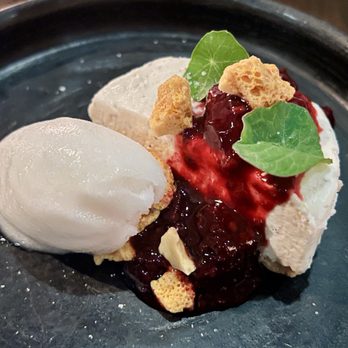 Jun - Goat cheesecake with black peppercorn, ginger lychee sorbet, honeycomb candy, macerated berries - New American Near Me - Houston, Texas