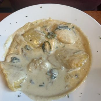 CC Tomatoes - Autumn Chicken - Oyster dish with a creamy white sauce, garnished with herbs, served on a white plate at a casual dining restaurant. - Pizza Near Me - Concord, New Hampshire