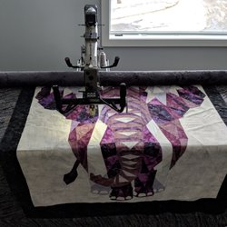 Quiltessential Company - We can long arm your quilt on our Gammill machines.