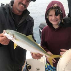 Catalina Coastal Tours & Fishing - Captain Lance and 11 year old Teddy with his first yellowtail