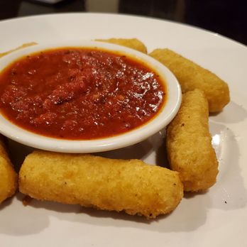 Bella Napoli - a white plate with a bowl of tomato sauce - Italian Near Me - Rockwall, Texas