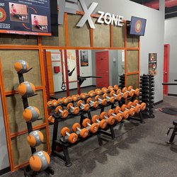 HOTWORX - Louisville - Hotworx-browsnboro open non-heated area the FX Zone with free weights and virtual instructor led sessions.