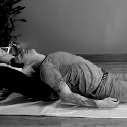 Thai massage stretch and traction for the spine and neck.